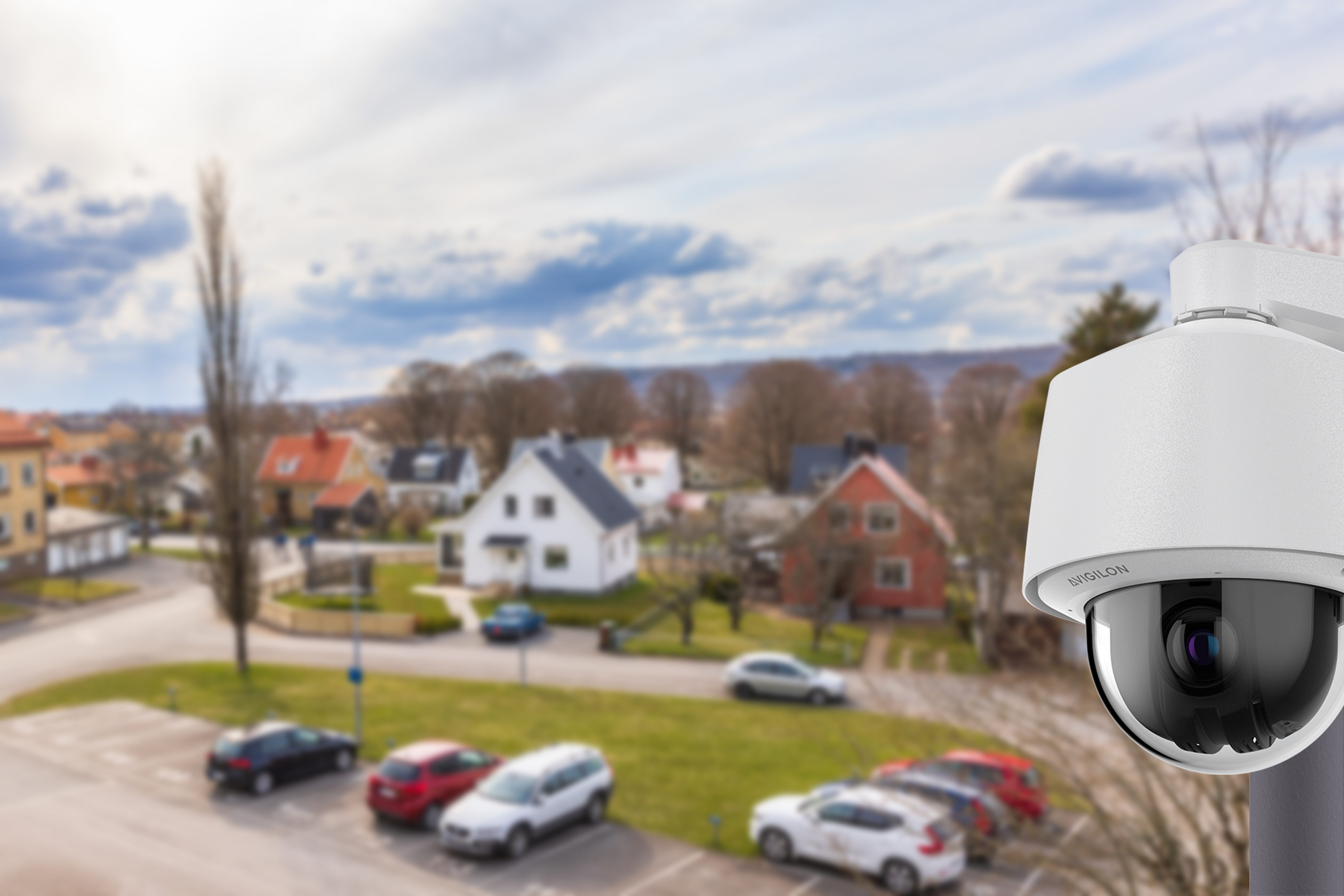 Avigilon outdoor PTZ camera monitoring a parking lot of vehicles